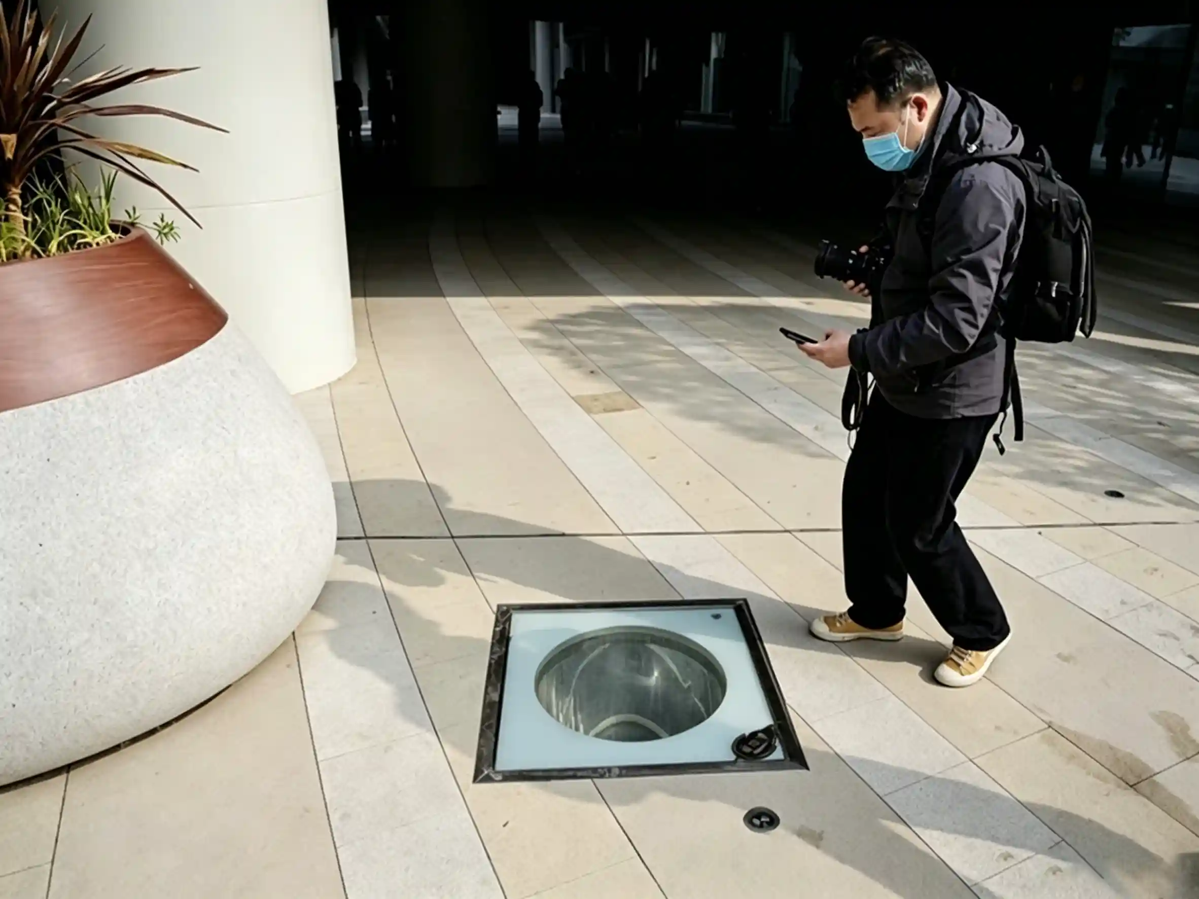 Lightweight concrete planters used on active commercial subterranean vaults to mitigate dead-load.